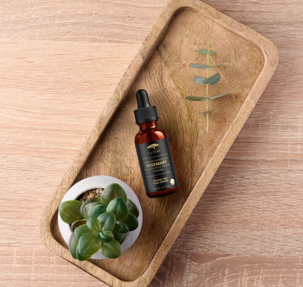 IAMPURE Rosemary essential oil on a wooden tray