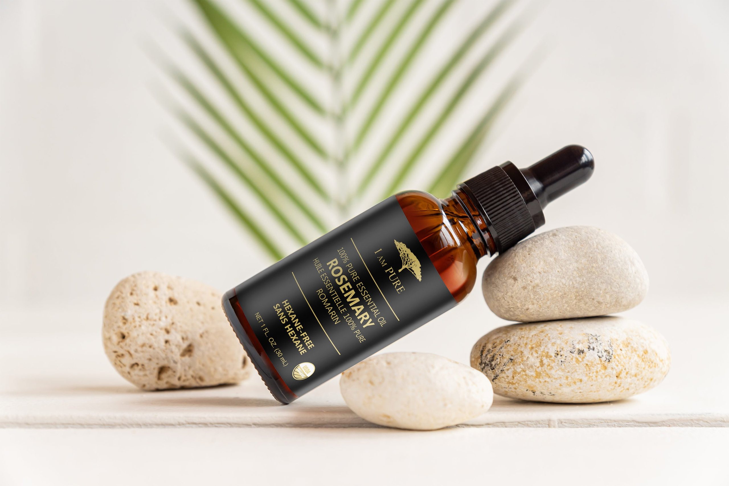 IAMPURE Rosemary oil balanced on stones