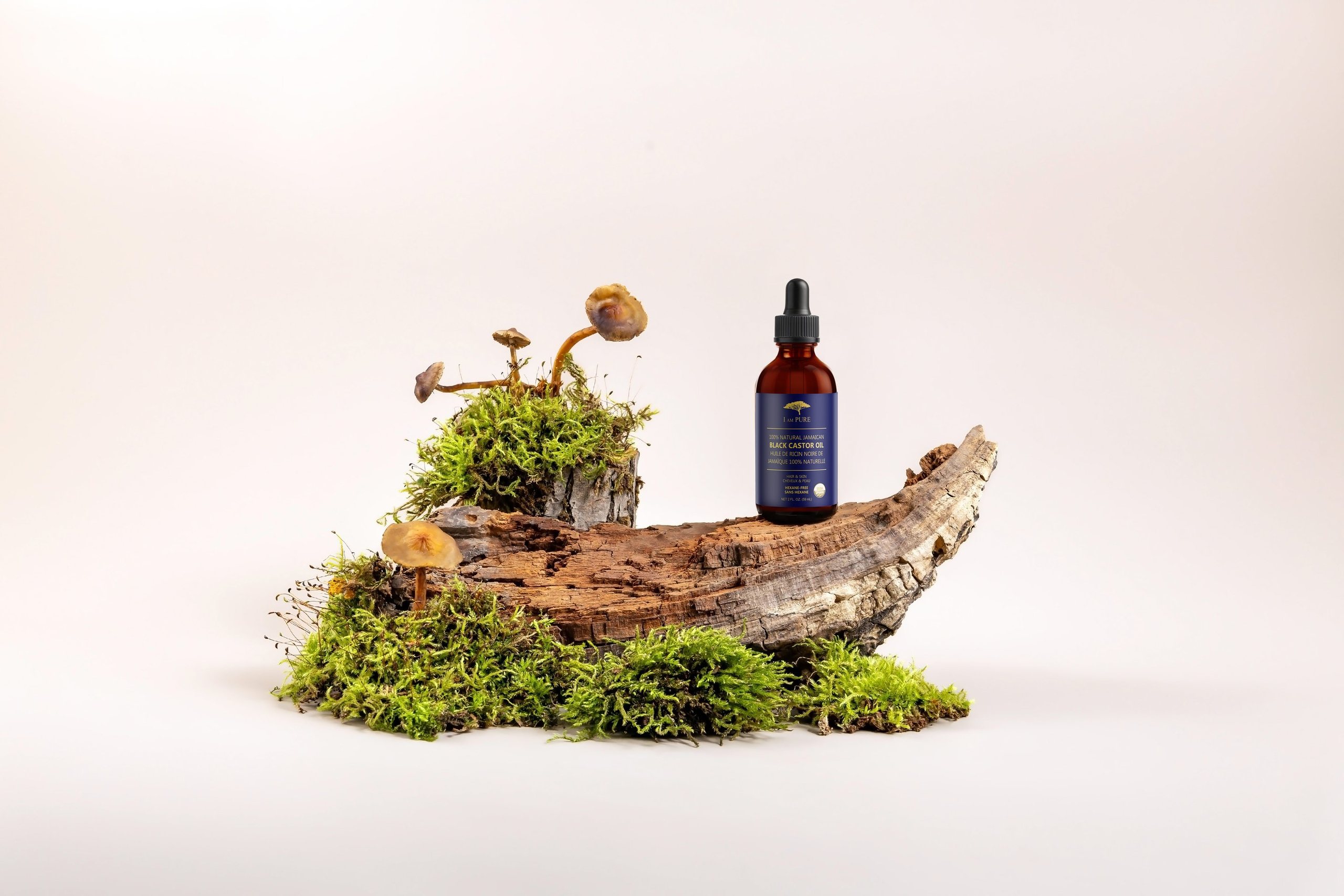 IAMPURE bottle on mossy driftwood