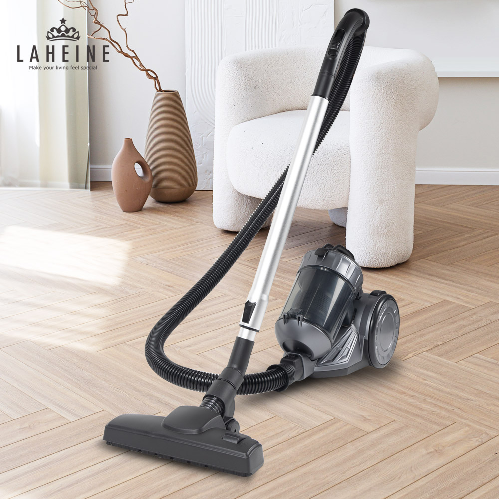 LAHEINE canister vacuum on a herringbone floor