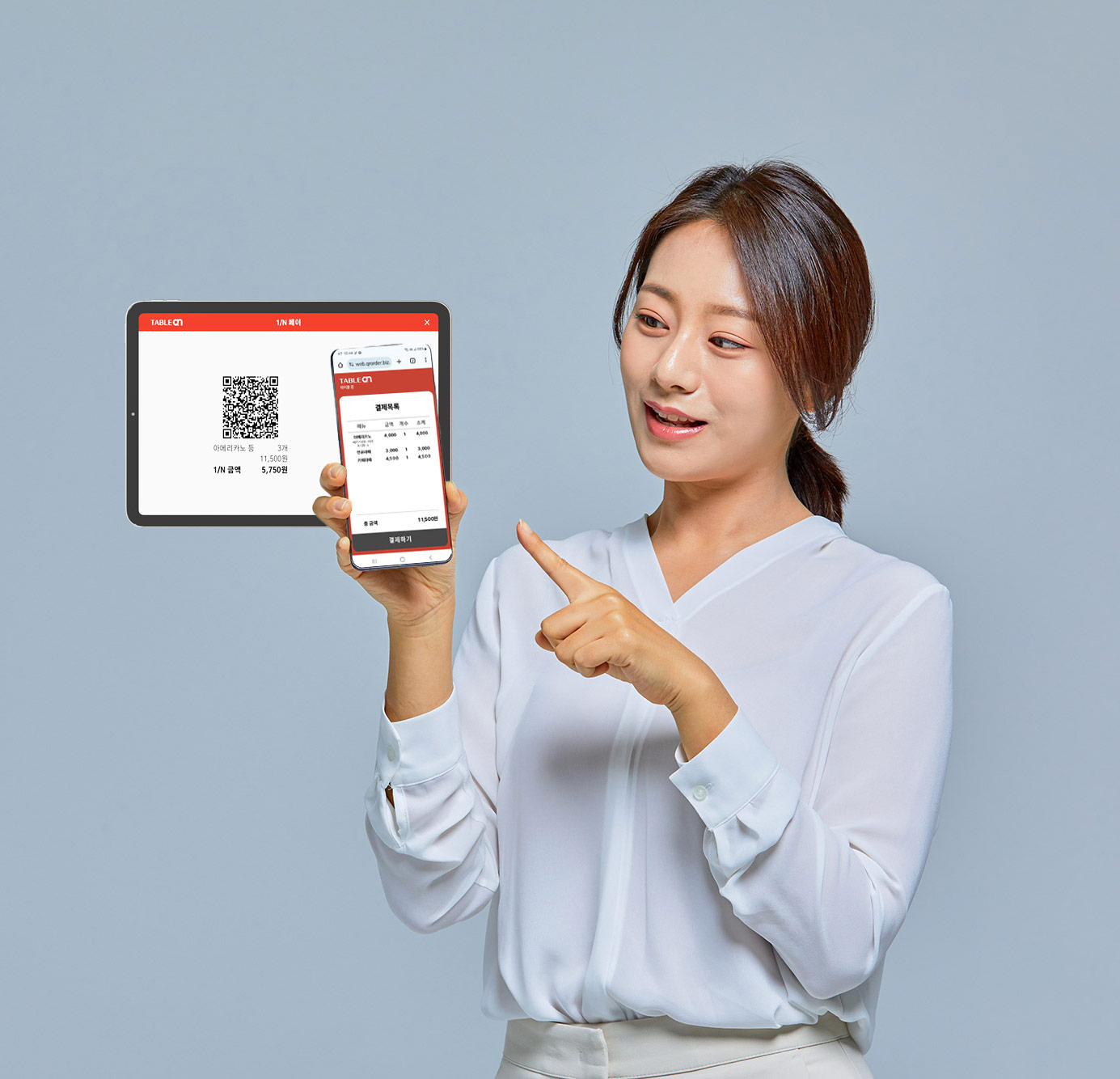 Woman showing TableOn split payment on a phone and tablet