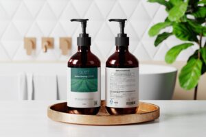 Front and back labels of GLATT Before Shaving Lotion on a wooden tray